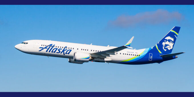 Alaskan airlines plane flying through the air