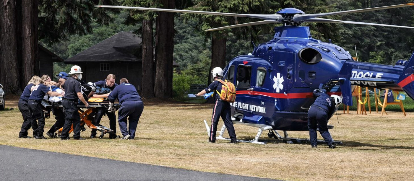 patient being moved towards helicopter