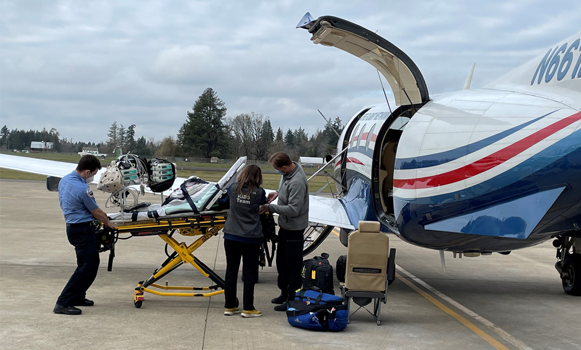 EMT and Life Flight crew load a neonatal patient into the PILATUS PC-12 NG