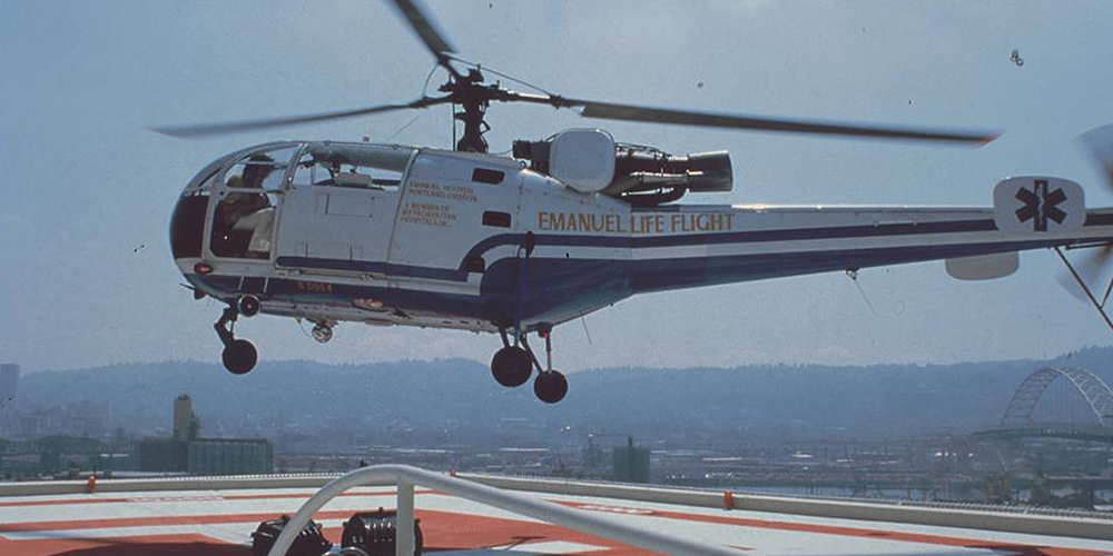 Circa late '70s historical photo of classic Emanuel Life Flight helicopter landing at Emanuel hospital